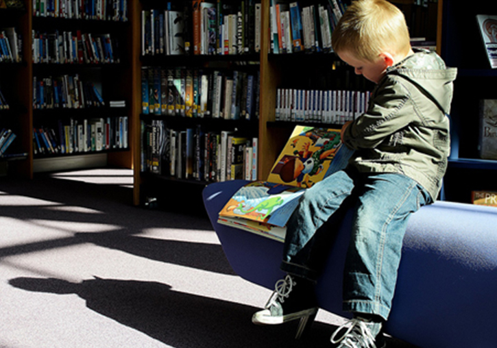 A kid reading.